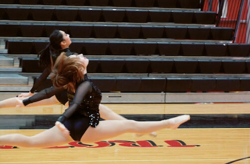 Emma Silverman and Lindsay Huynh doing split leaps at the MA Classic Competition. (January 2022)